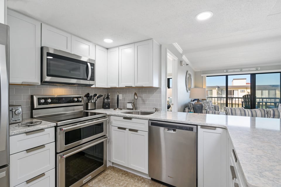 The chef in your family won't mind making meals in this kitchen complete with a double oven and a view!