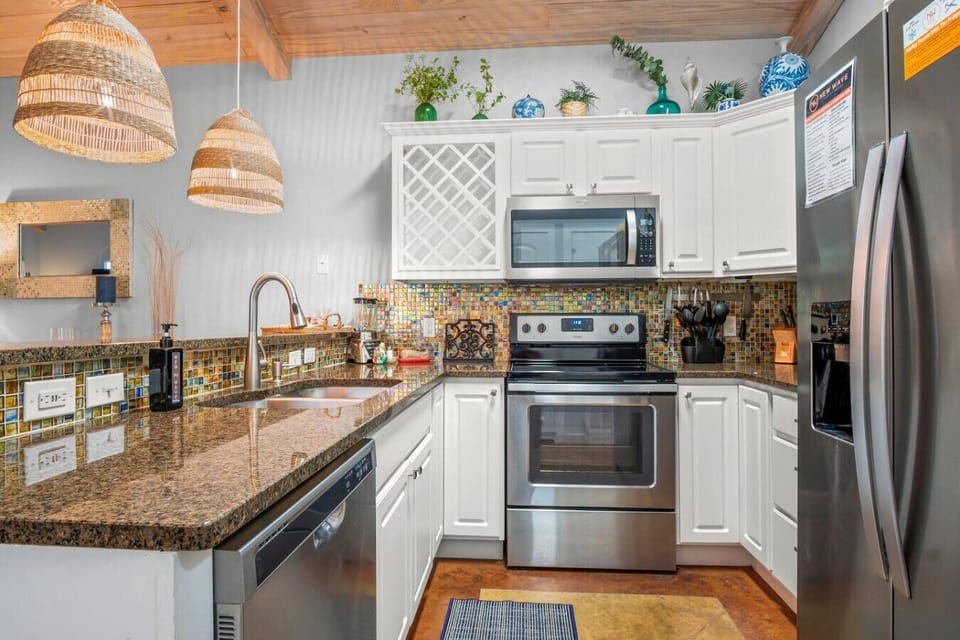 Fully Equipped Kitchen with Stainless Appliances, Granite Counters & Island Seating