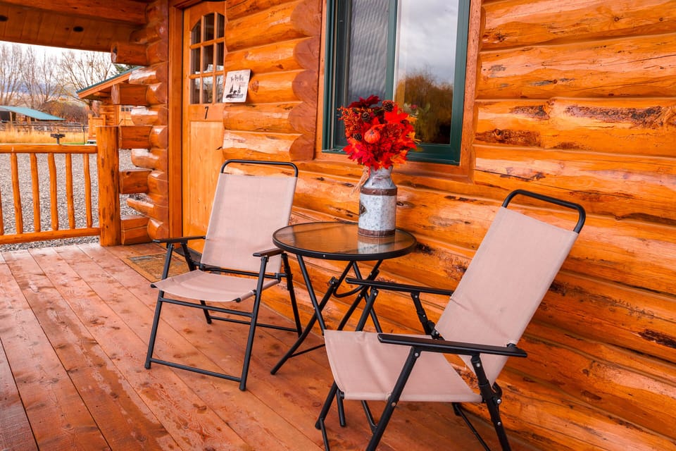 Beautiful, private porch with a bistro style table and chairs.