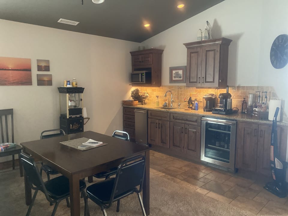 Game room - prep bar, game tables, popcorn machine, cards & board games