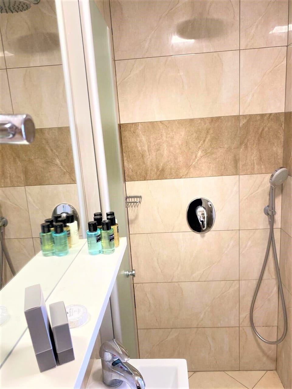 Shower, rainfall showerhead, towels, soap