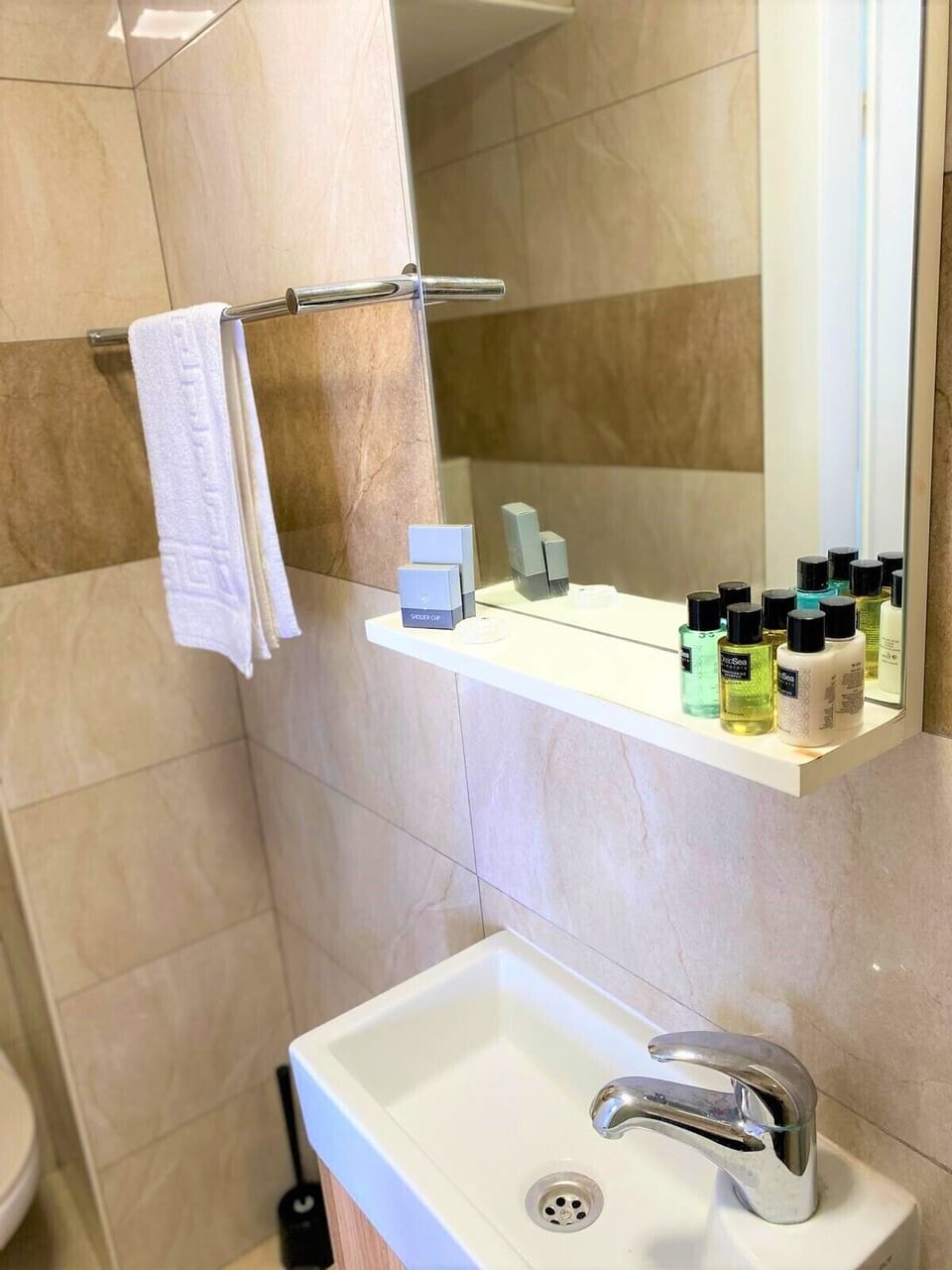 Shower, rainfall showerhead, towels, soap