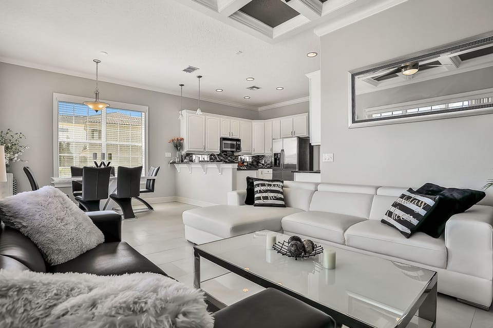 This modern living area has been designed with sophisticated black and white furnishings.