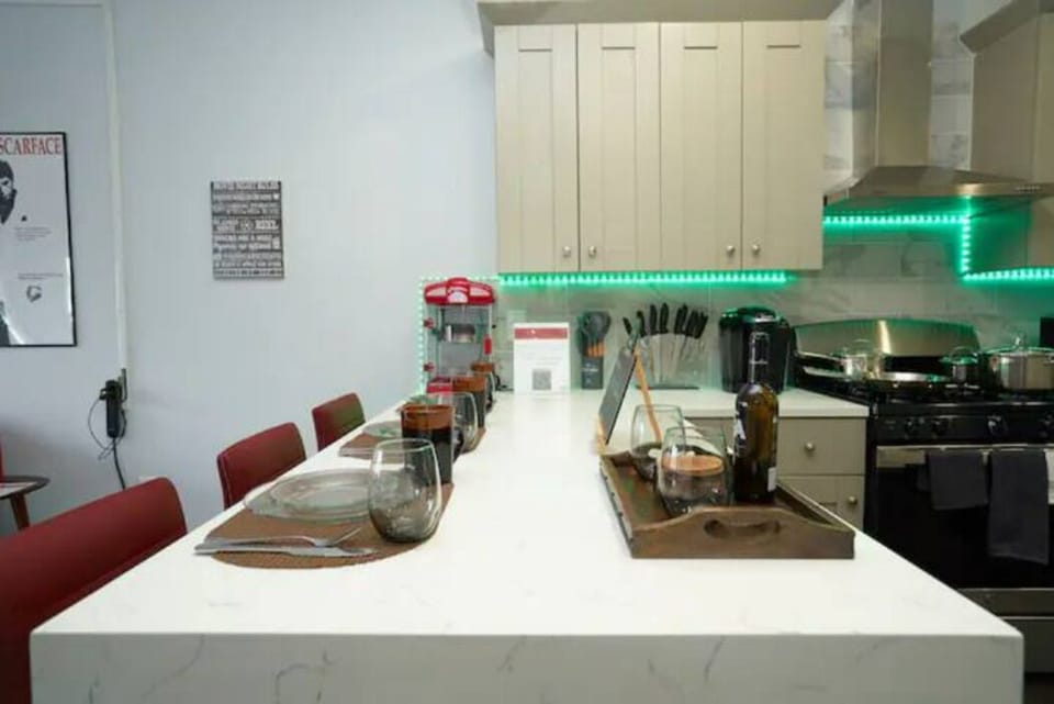 Discover a charming kitchen nook with a cozy table and comfortable high chairs. Enjoy quick meals and warm conversations in this intimate and inviting space.