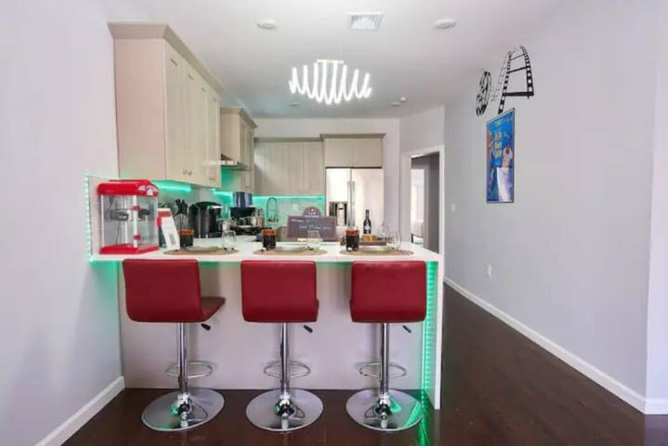 Discover a charming kitchen nook with a cozy table and comfortable high chairs. Enjoy quick meals and warm conversations in this intimate and inviting space.