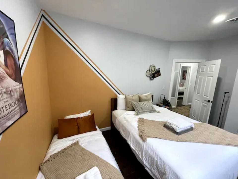 Welcome to our spacious bedroom, thoughtfully designed for comfort and productivity. Two cozy beds provide ample sleeping space, perfect for family or friends. A well-equipped work station offers a dedicated area for focus and creativity. Whether you're unwinding or working, this versatile bedroom ensures a restful and productive stay.

