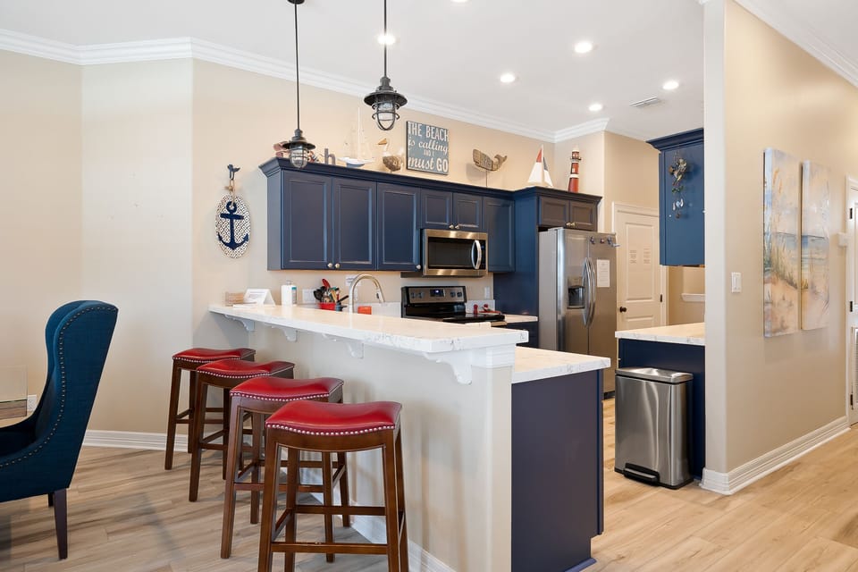 Fully stocked kitchen with pots, pans, and utensils to prepare home cooked meals!