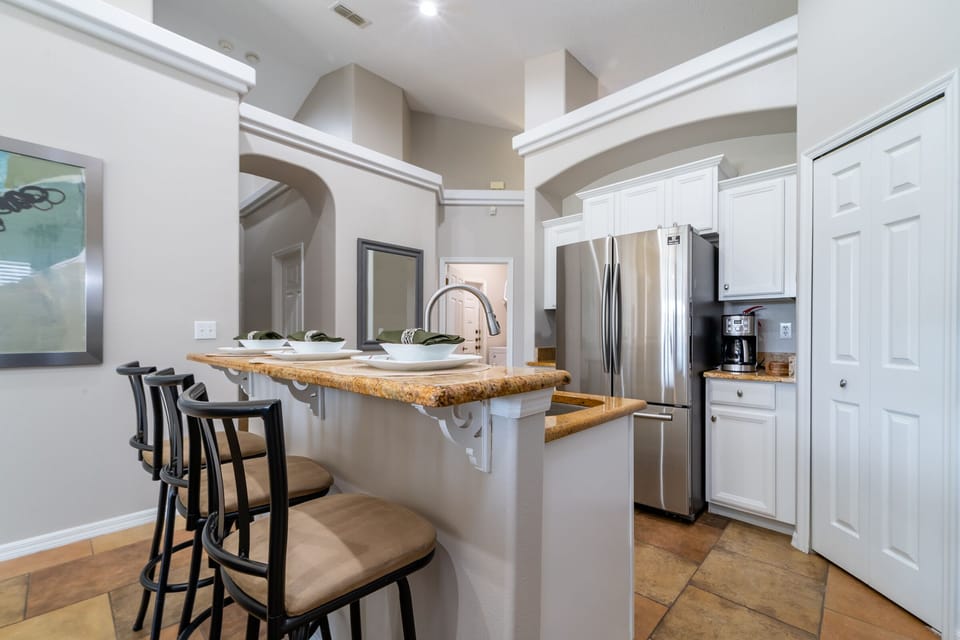 Kitchen showing breakfast bar