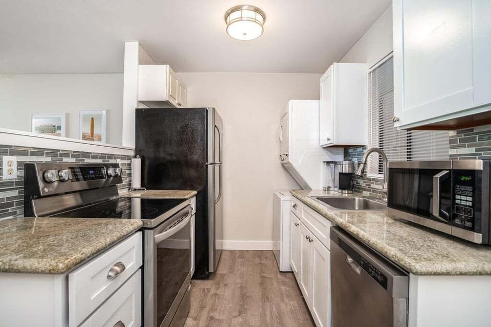 Stacked washer and dryer are available for guests' use.