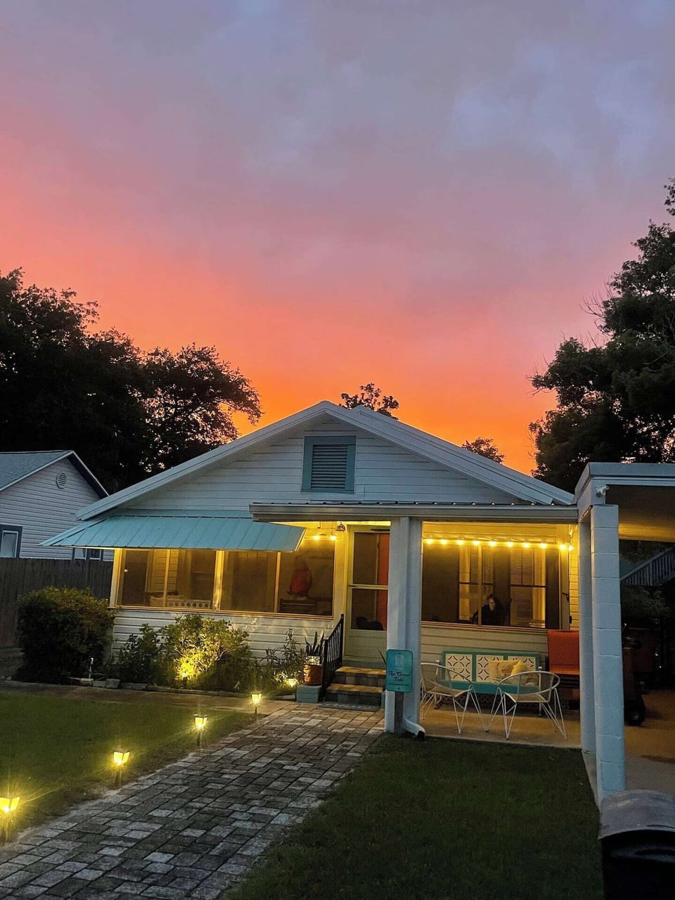 Walk to dinner as the sun drops over St. Joe Bay — this is peak PSJ.