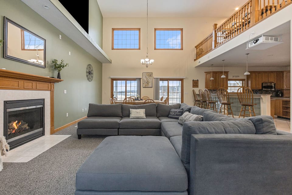 The living room has a 55” smart tv and large sectional sofa