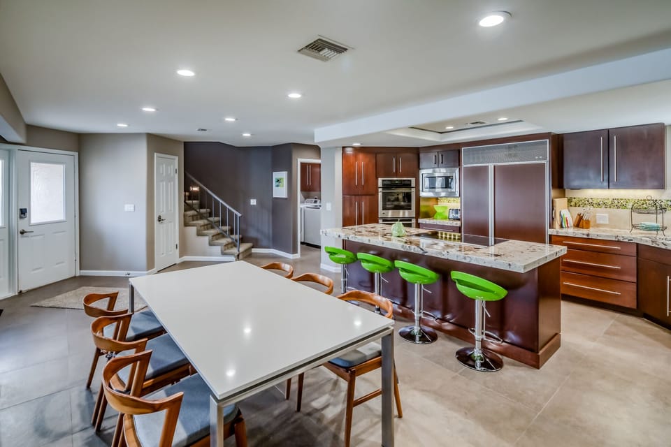 Dining Table is Quartz, Kitchen is Granite