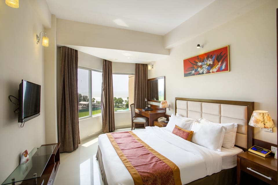 Executive Suite, 1 Bedroom, Sea View | In-room safe, desk, laptop workspace, iron/ironing board