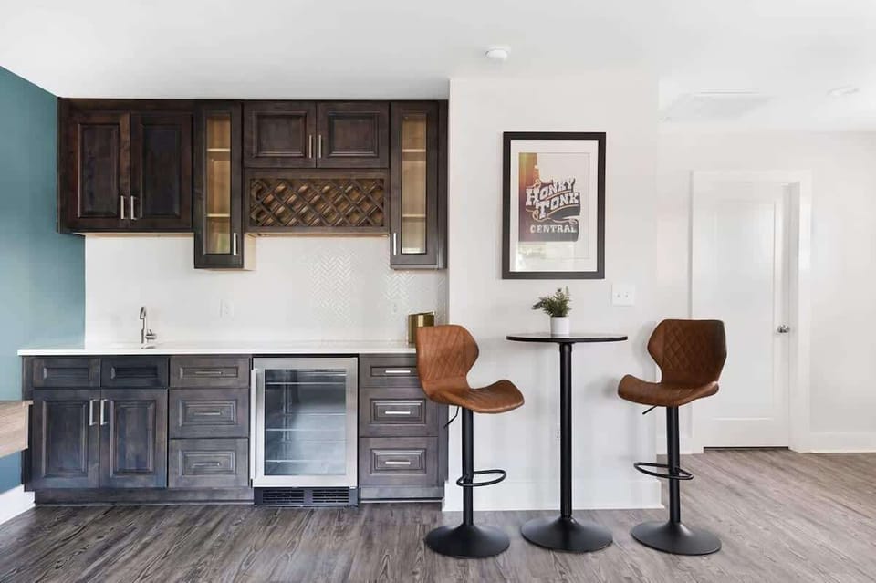 Modern wet bar with wine storage and counter seating — perfect for entertaining.