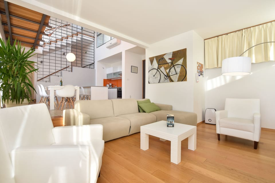 Deluxe Villa | Living area | 55-inch LED TV with cable channels