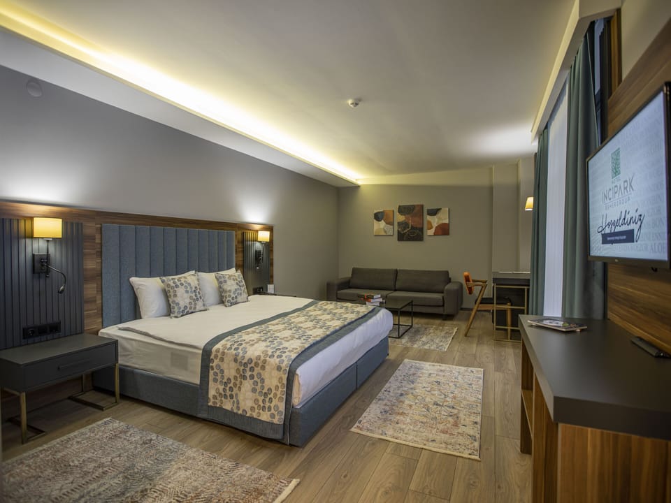 Deluxe Room | Select Comfort beds, minibar, in-room safe, desk