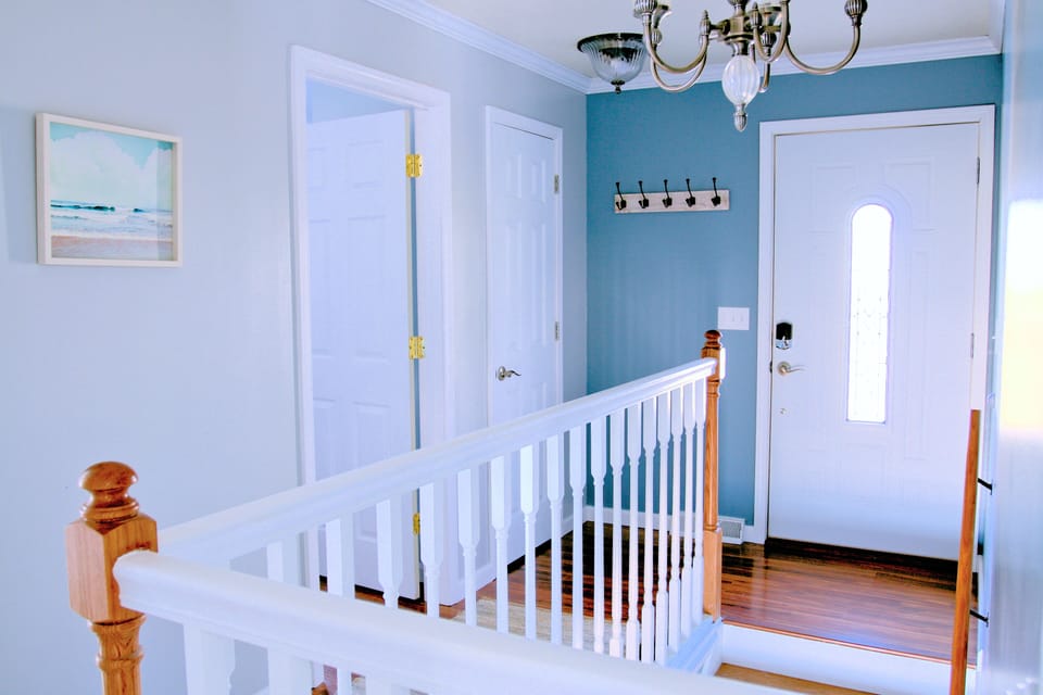 Street level hallway with door to Queen bedroom, Closet and Street side door