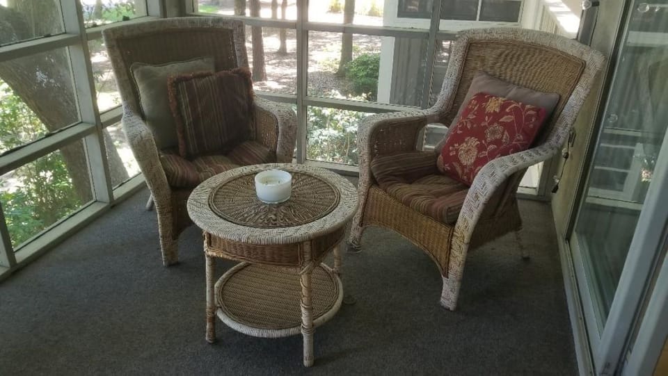 Relaxing chairs on screened porch