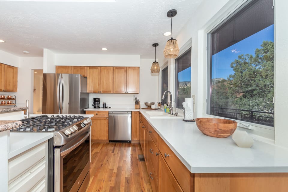 Bathe in natural light as you step into the heart of this home—a modern chef's kitchen designed for both style and function.