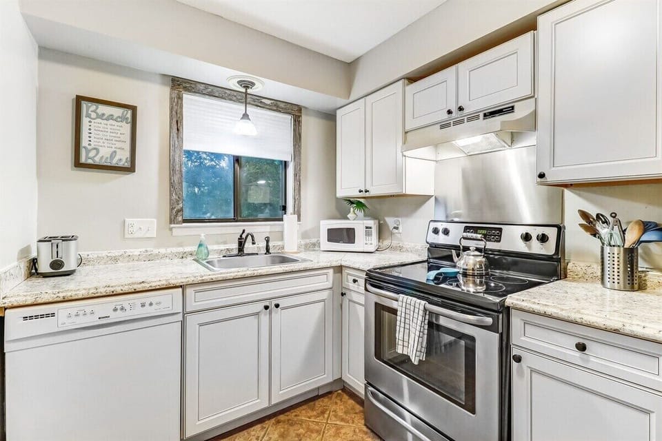 Bright White Cabinets and Light Filters in from Window