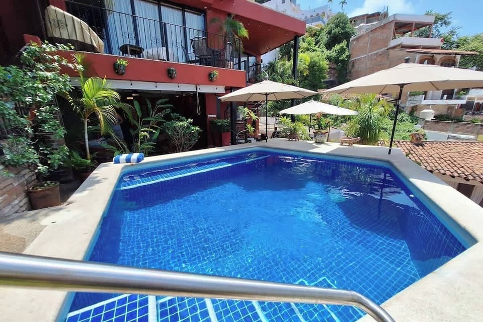 The heated, shared saltwater pool with ocean view and built-in bench seating is just steps away.