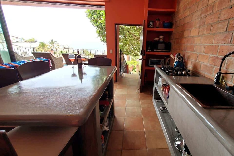 The concrete center island is a great spot to entertain, take in a meal or mix up your favorite beverage.  Outlets below the counter are convenient to charge your devices or use as a work desk.