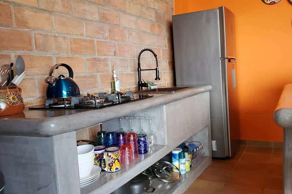 Plenty of glassware and plates.  The refrigerator with automatic ice maker.