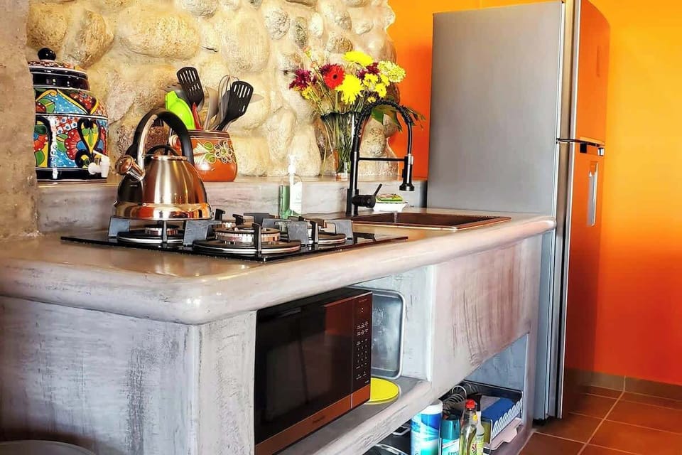 Gas stove top and custom hand hammered copper sink.