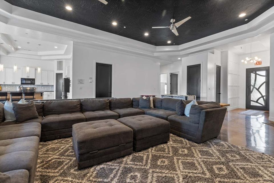 The living room is complete with a plush sectional that offers plenty of seating, arcade games, and a Flat Screen TV so big that it can be viewed from the Kitchen.