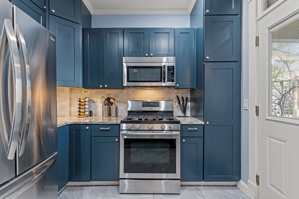 Located on the main level, this fully equipped kitchen features modern finishes, ample counter space, and everything you need for your stay just minutes from Westport’s restaurants and nightlife.