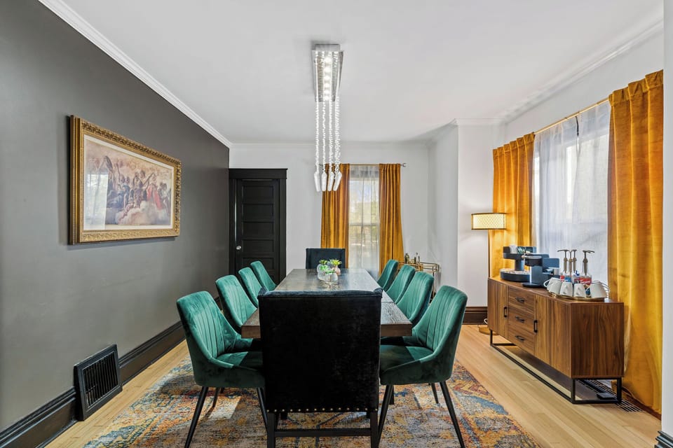 Bright and stylish dining room with a large table and chic lighting—ideal for group dinners, game nights, or remote work sessions.