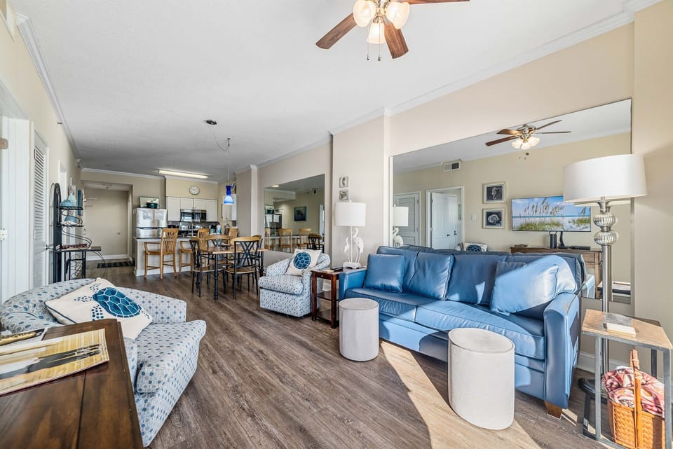 Light and airy living space featuring coastal-inspired decor and a seamless flow between the living and dining areas.