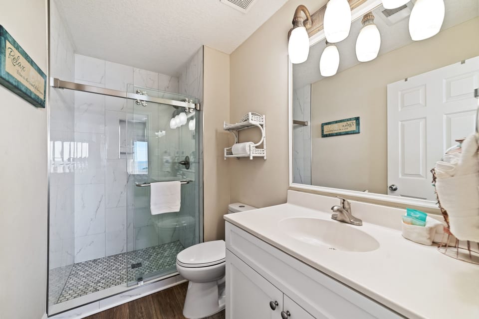 A bright and functional bathroom designed for comfort. Enjoy a clean and refreshing space during your stay.