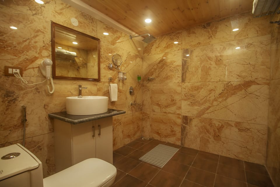 Temple View Room With Balcony | Bathroom | Shower, rainfall showerhead, hair dryer, bathrobes