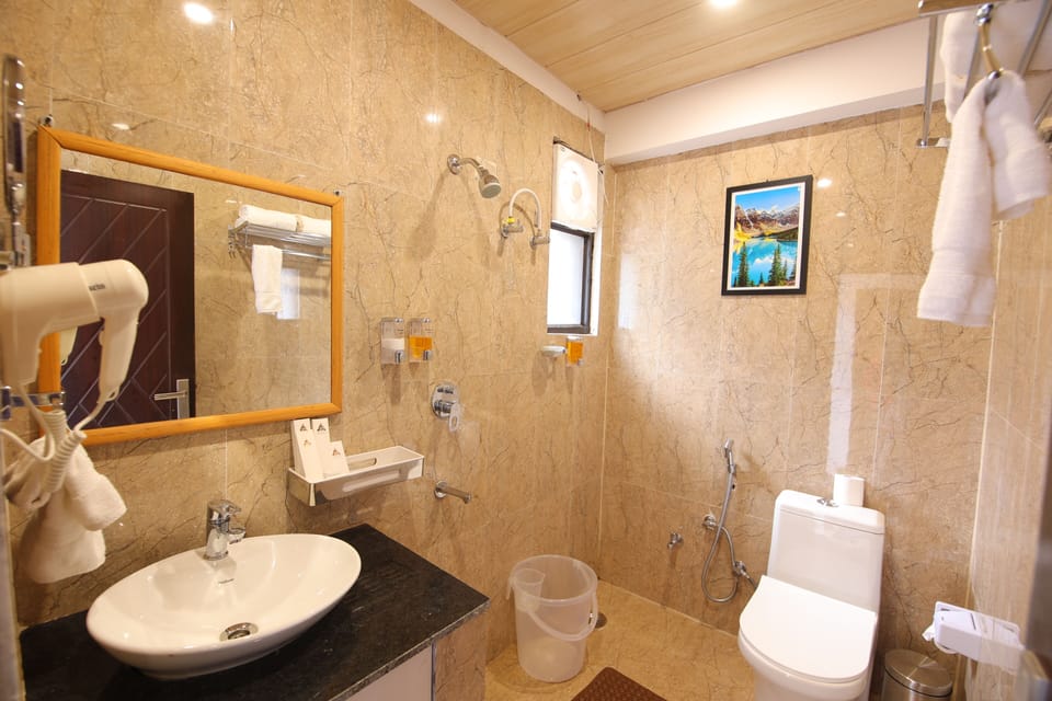 Temple View Room With Balcony | Bathroom | Shower, rainfall showerhead, hair dryer, bathrobes