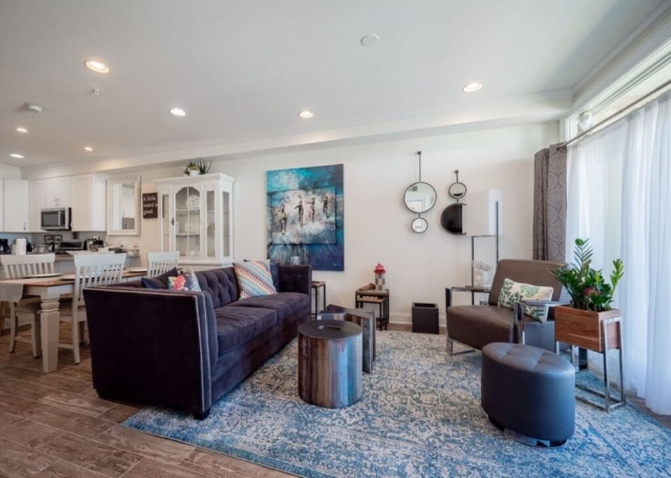 Open living space offers a queen Michell Gold Fiona sleeper sofa and bay views.