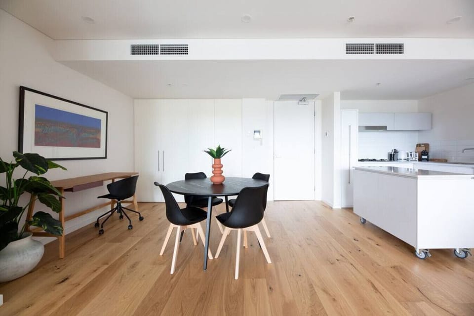 A modern interior design and open-plan dining area onto the kitchen.