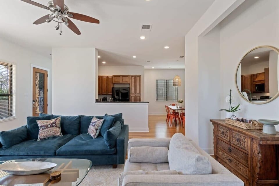 Open layout of living room, dining and kitchen area