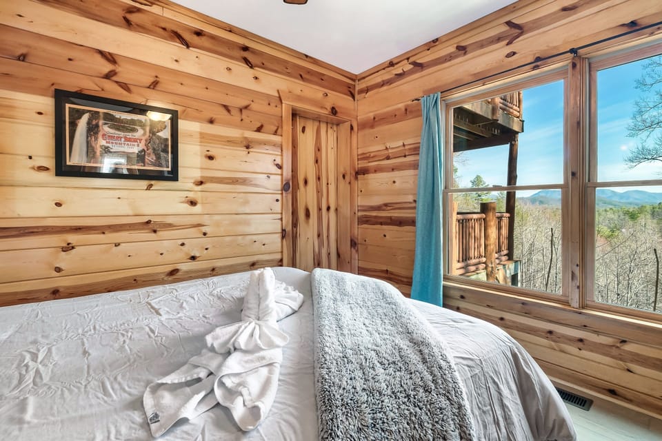 Lower level queen bedroom with a lovely view of the mountains