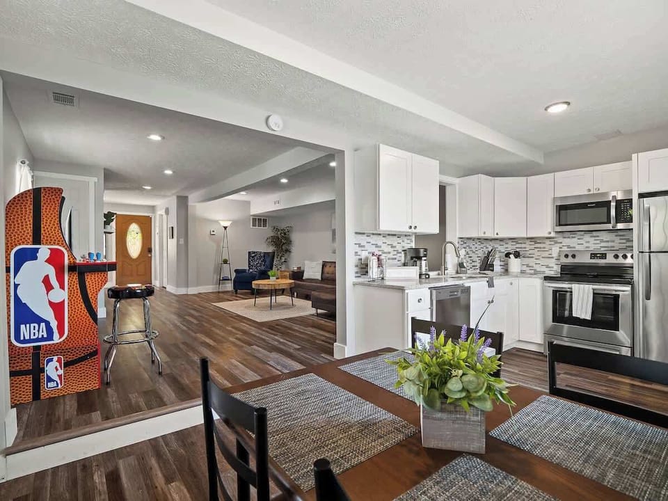 Bright open layout connecting kitchen, dining & living spaces for easy gathering