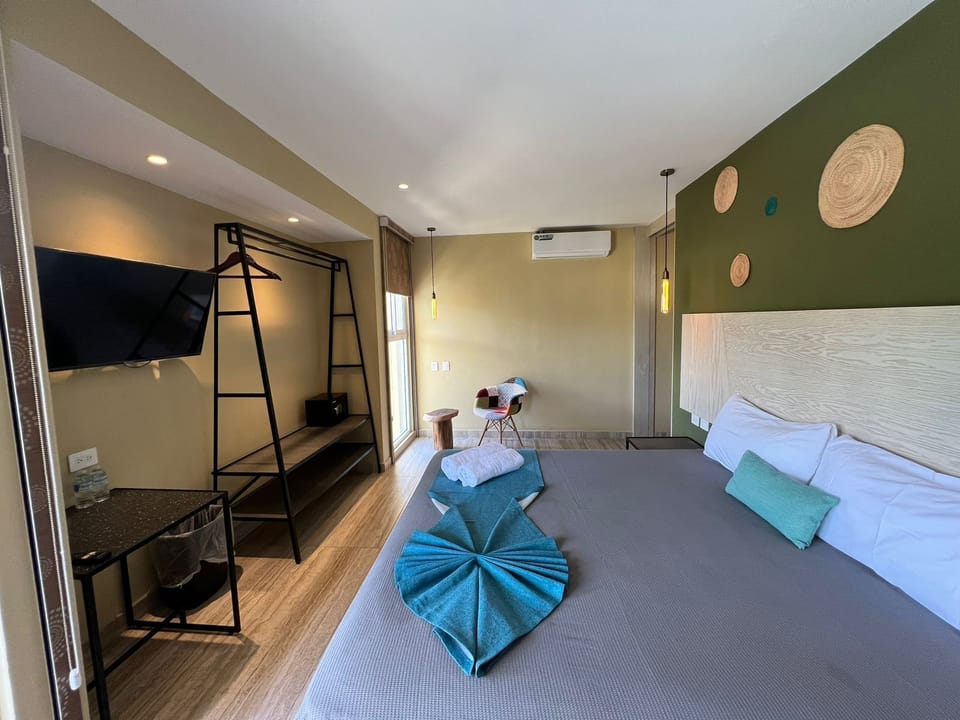 Deluxe Pool View | In-room safe, desk, laptop workspace, iron/ironing board