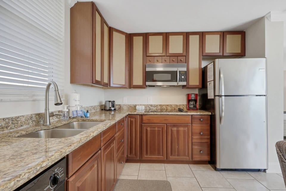 The kitchen is appointed with refridgerator/freezer, dishwasher, microwave and smooth cooktop (there is no stove.)
