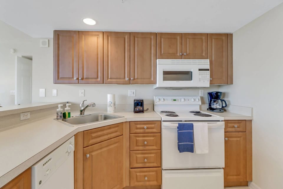 The open kitchen contains a full size refridgerator/freeze, oven, dishwasher and microwave.