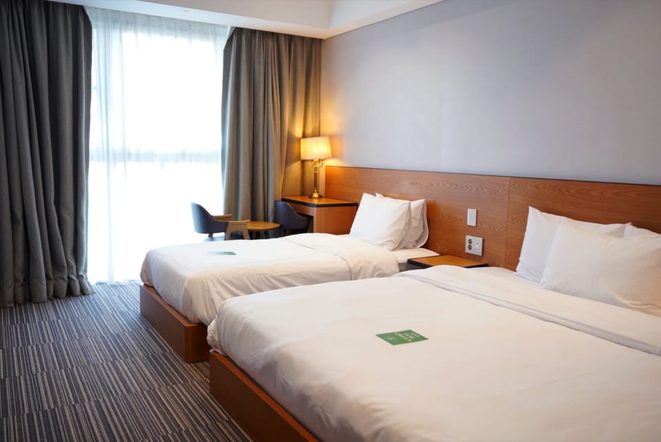Deluxe Family Room (3 days of free parking) | Free minibar, blackout drapes, soundproofing, bed sheets
