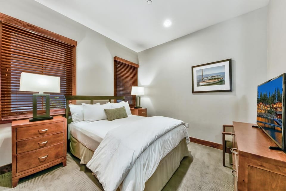 Sink into crisp white linens and wake refreshed in your peaceful retreat with warm wood accents and natural light.