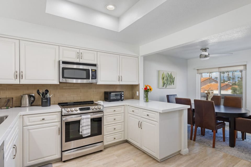 Bright, fully equipped kitchen with plenty of counter space, making it easy to cook, snack, and gather during your stay.
