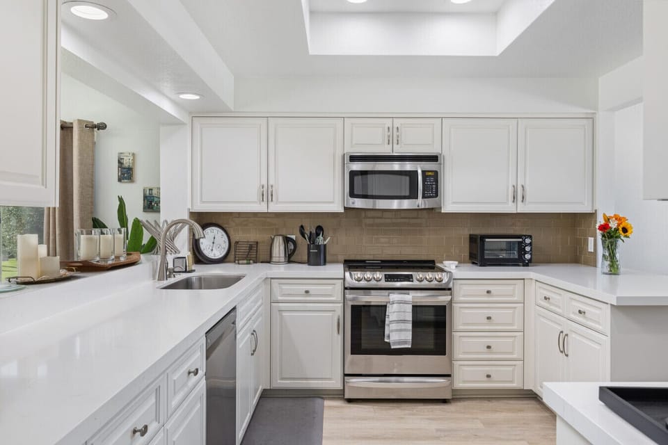 Spacious, fully stocked kitchen with modern appliances and plenty of room to prep meals together during your stay.