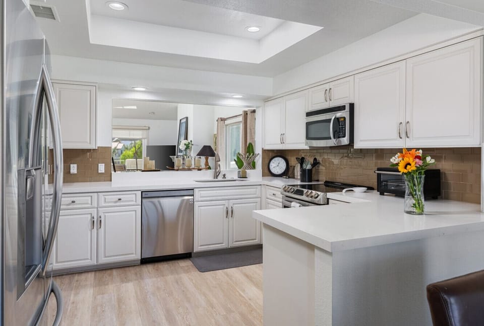 Open, well-organized kitchen with lots of counter space that makes cooking and hanging out together feel easy and relaxed.