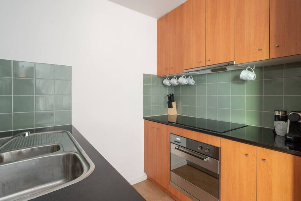 [Kitchen] Cooktop, oven and coffee maker.