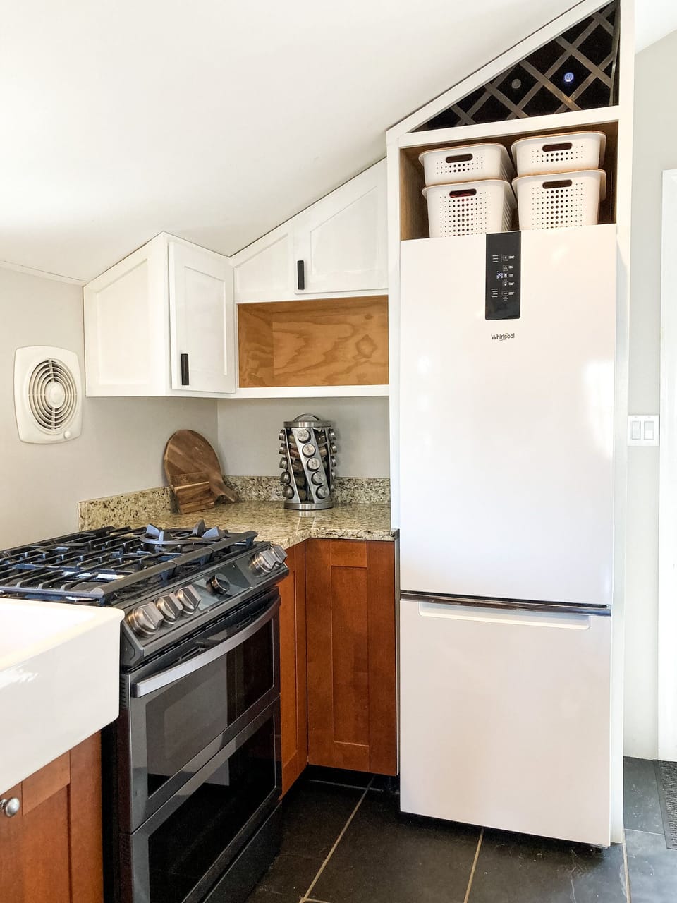 There is a four burner gas stove and range oven in the kitchen. 